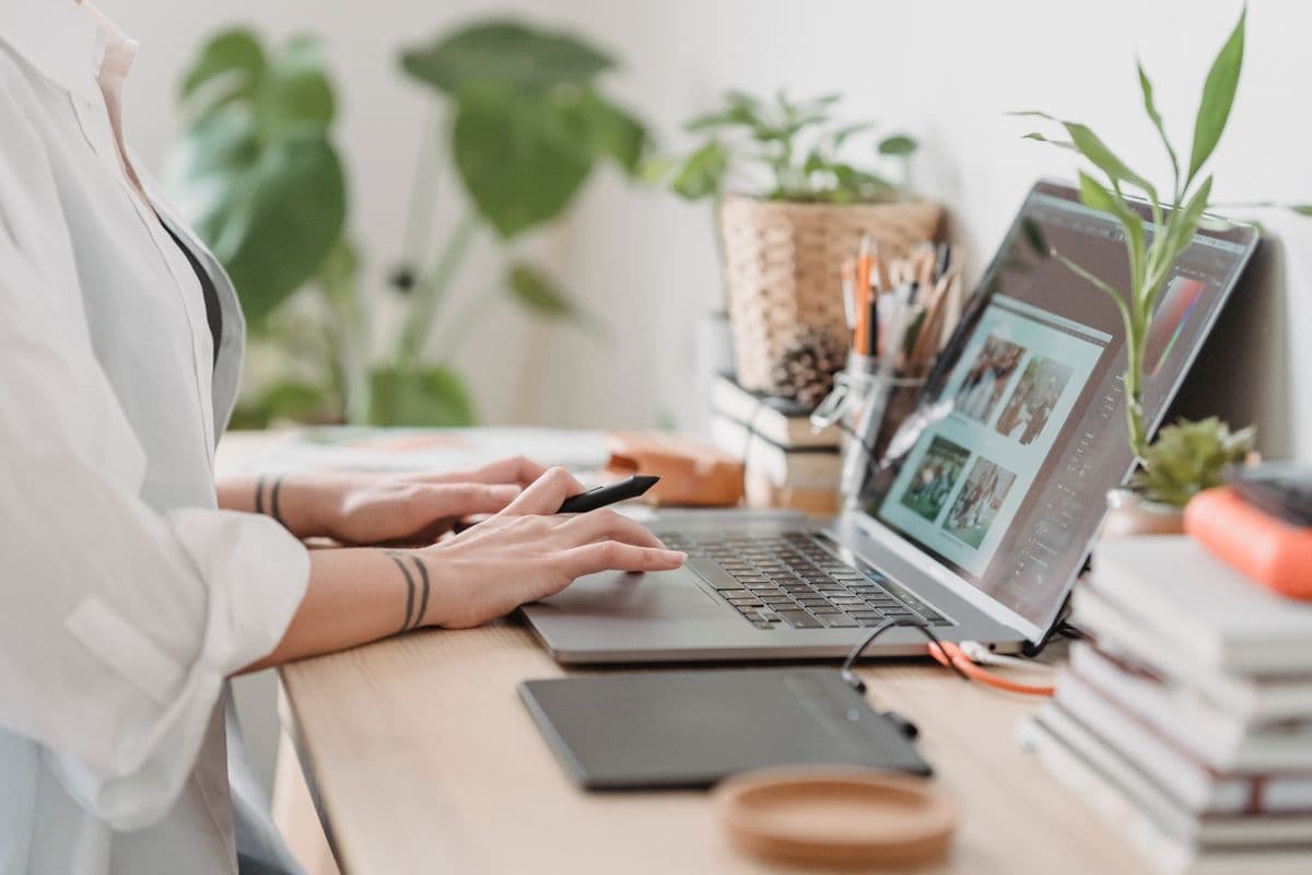 Busy professional working from home with thriving low-maintenance indoor plants
